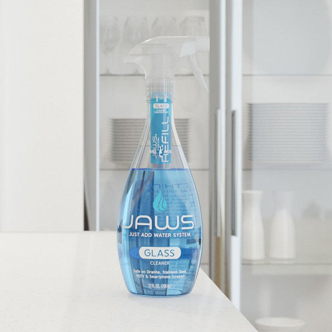 JAWS Glass Cleaner bottle on white counter.