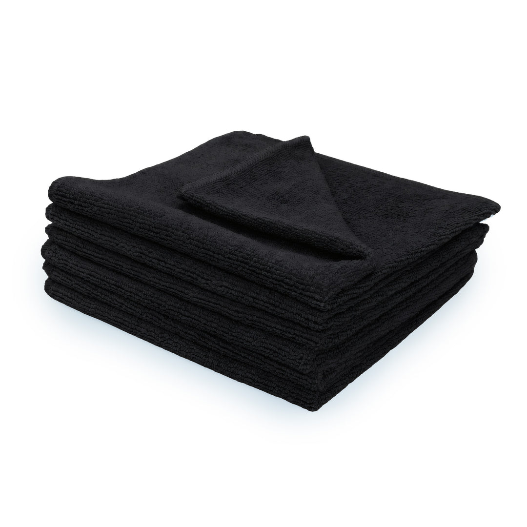 Stack of 6 black microfiber towels on a white background.