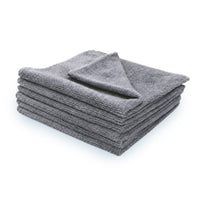 Stack of 6 gray microfiber towels on a white background.