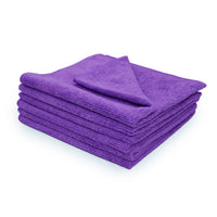 Stack of 6 purple microfiber towels on a white background.