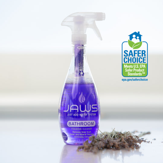 JAWS Bathroom Cleaner bottle on reflective surface with dried lavender next to it.  EPA Safer Choice logo displayed 