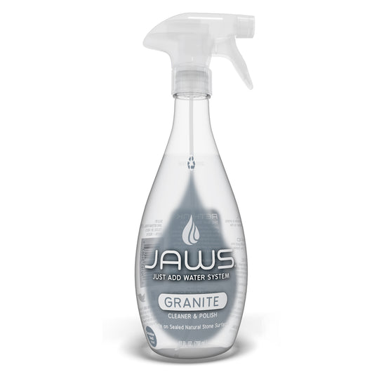 Empty JAWS Granite Cleaner Spray bottle on a white background.