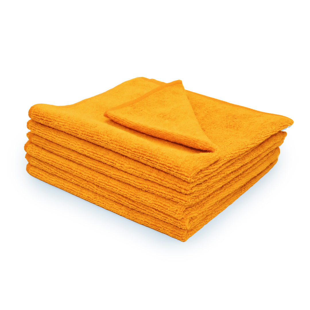 Stack of 6 orange microfiber towels on a white background.