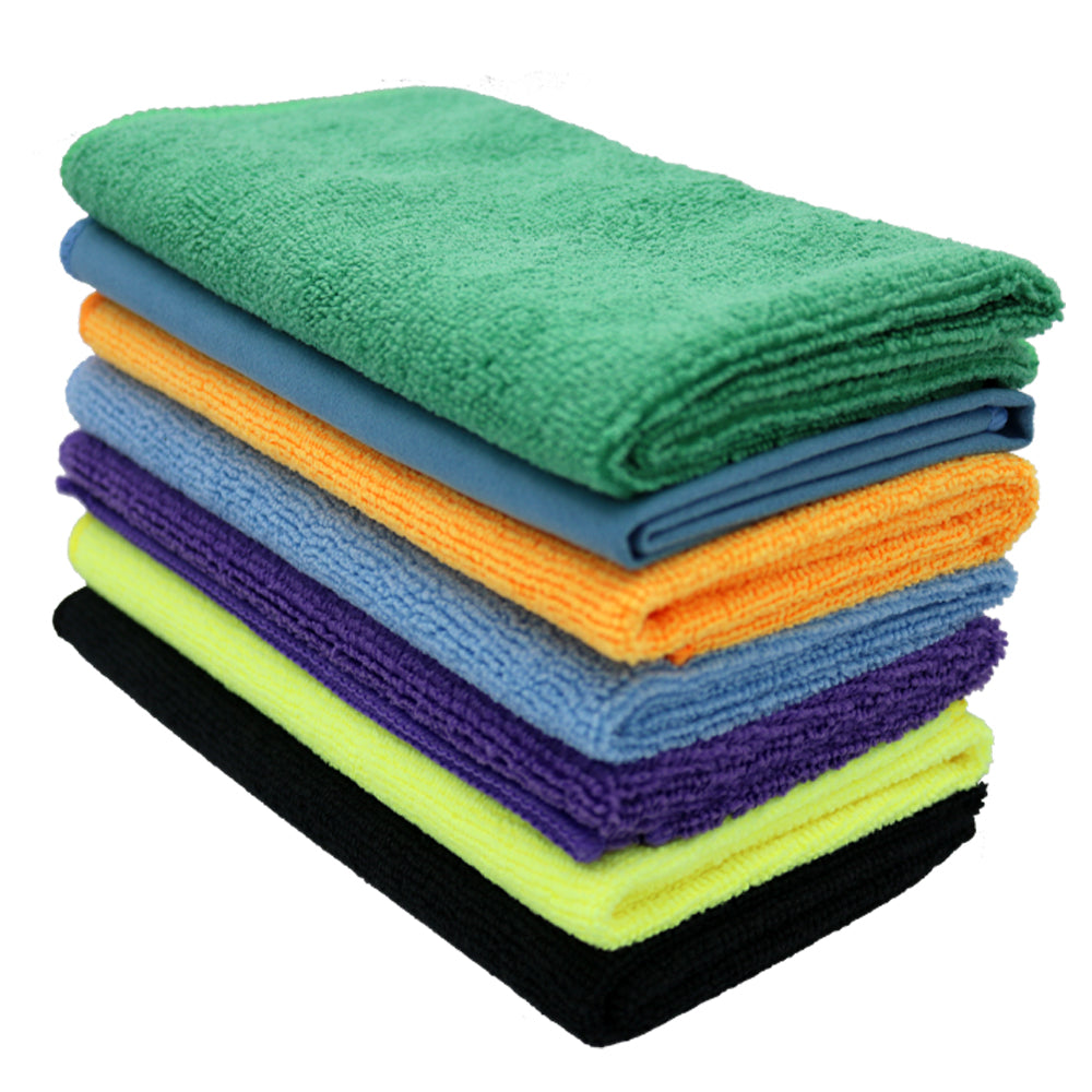 A stack of seven folded microfiber cleaning towels in various colors, including green, blue, orange, light blue, purple, yellow, and black, on a white background.