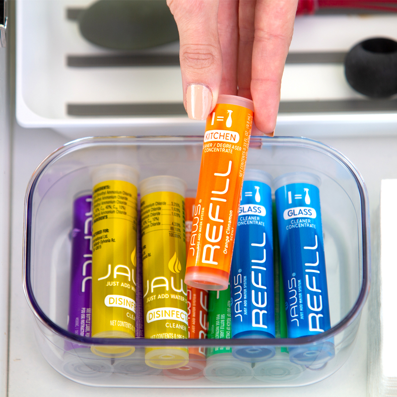 Hand pulling a JAWS REFILL out of container in drawer.