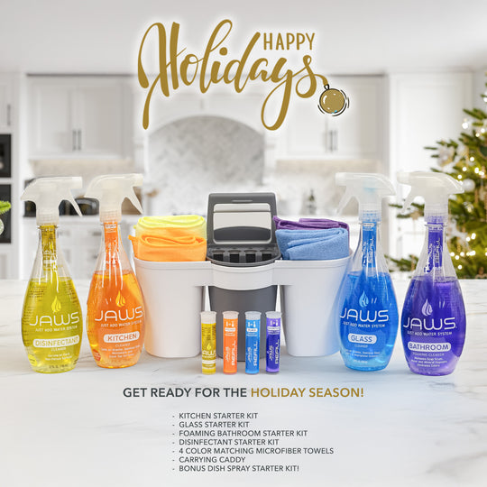 Caddy on counter with Disinfectant, Kitchen, Glass, and Bathroom Cleaner bottles sitting next, 4 refills in front, and microfibers in caddy.