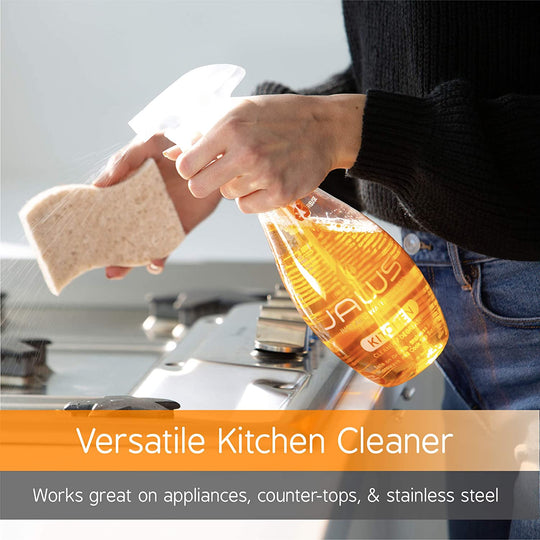 Person spaying stove top with JAWS Kitchen Cleaner with text about it's uses.