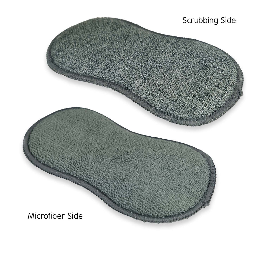Two gray cleaning pads on a white background.